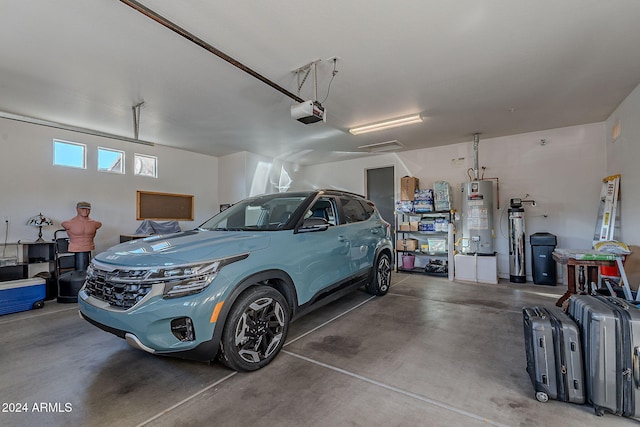 garage featuring gas water heater and a garage door opener