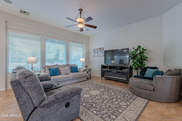 tiled living room with ceiling fan