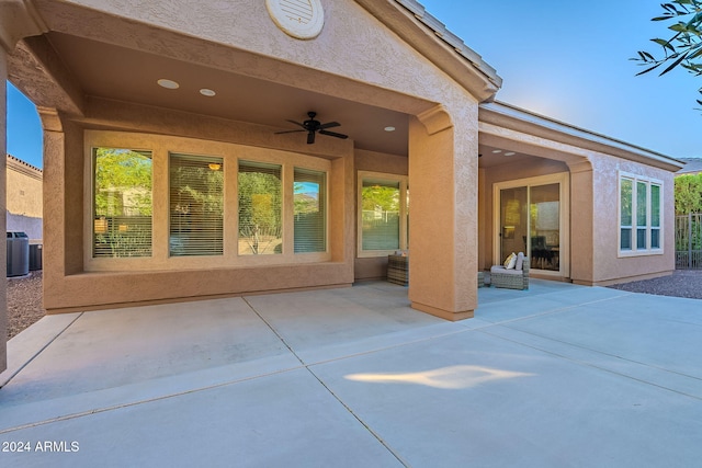 view of patio with ceiling fan and cooling unit