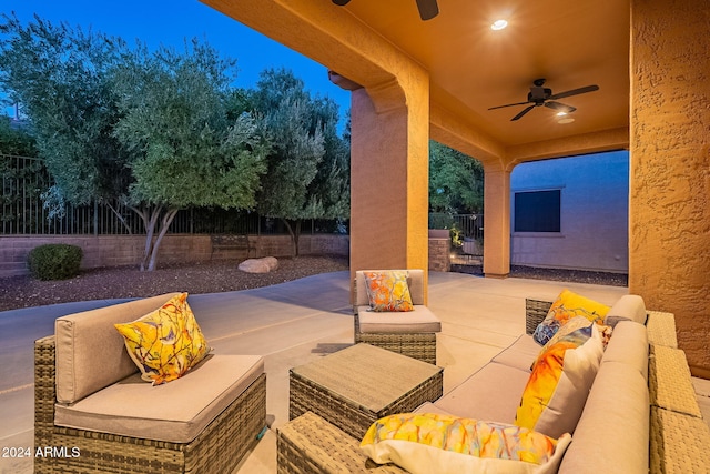 view of patio / terrace with ceiling fan and an outdoor living space