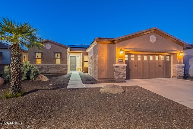 view of front of property featuring a garage