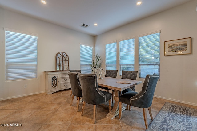 dining area with light tile patterned flooring