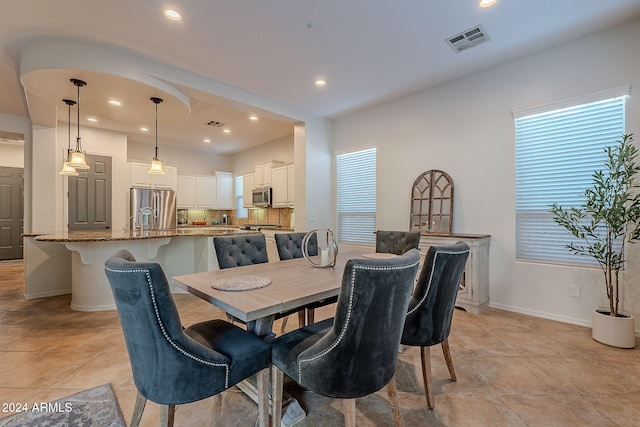 dining room featuring light tile patterned floors