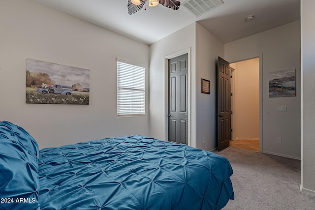 carpeted bedroom featuring ceiling fan