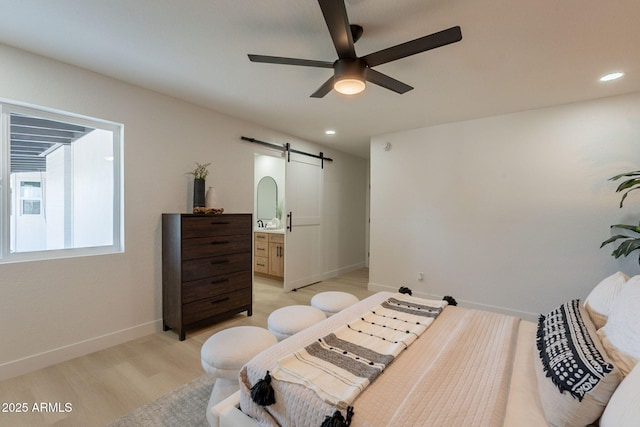 1609 W Yukon Dr, Phoenix, AZ 85027 - bedroom featuring a barn door, light wood finished floors, recessed lighting, a ceiling fan, and ensuite bath