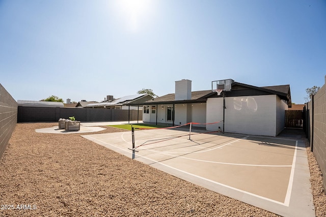 1609 W Yukon Dr, Phoenix, AZ 85027 - back of property featuring a fenced backyard, a chimney, and a tennis court