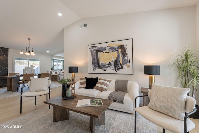 1609 W Yukon Dr, Phoenix, AZ 85027 - living area with light wood-style flooring, lofted ceiling, recessed lighting, and a chandelier