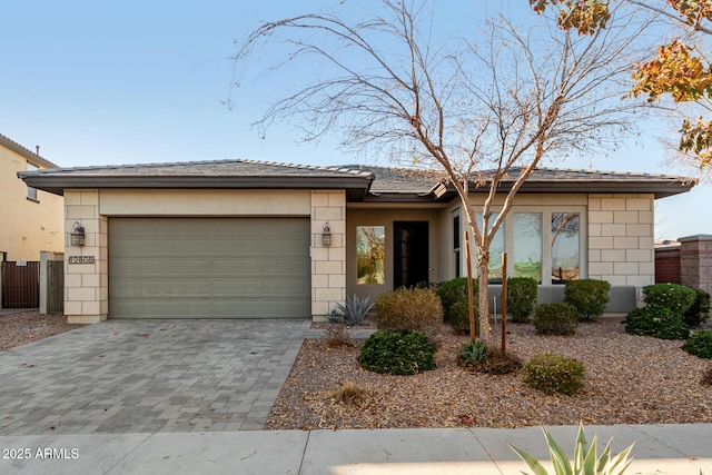 ranch-style home featuring a garage