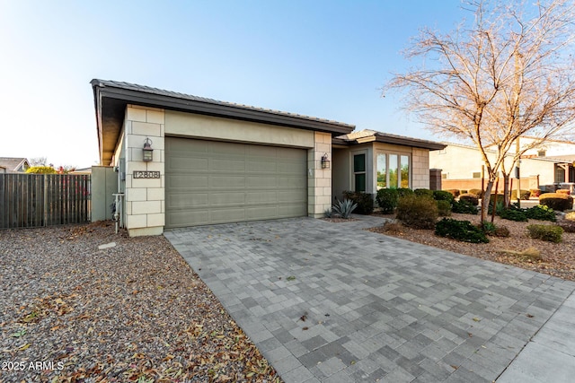 view of front of property featuring a garage