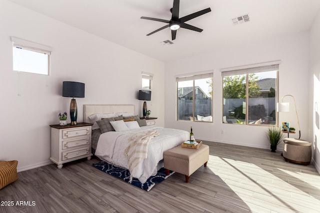 bedroom with hardwood / wood-style flooring and ceiling fan