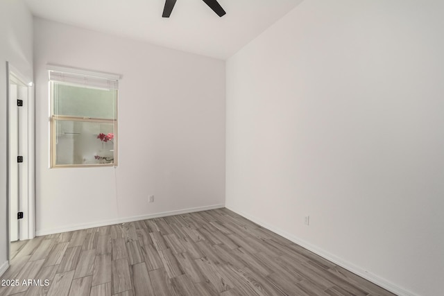 unfurnished room featuring ceiling fan and light hardwood / wood-style floors