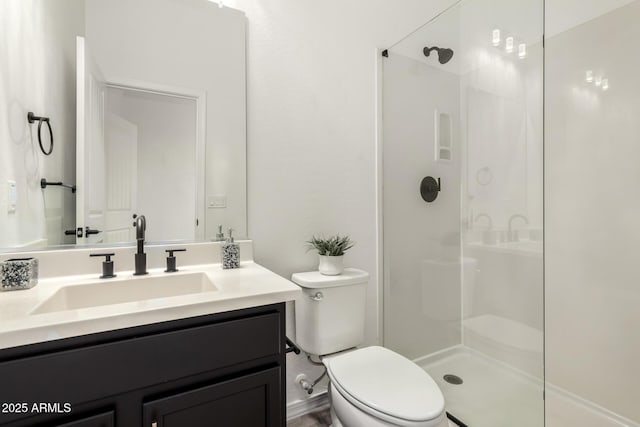 bathroom featuring walk in shower, vanity, and toilet