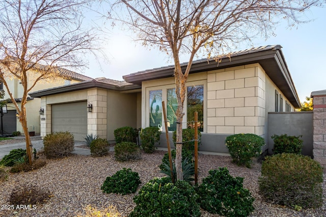 ranch-style home with a garage