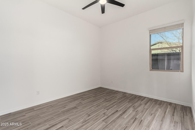 empty room featuring light hardwood / wood-style floors and ceiling fan