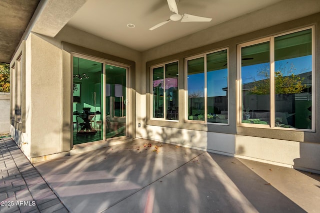 view of patio featuring ceiling fan