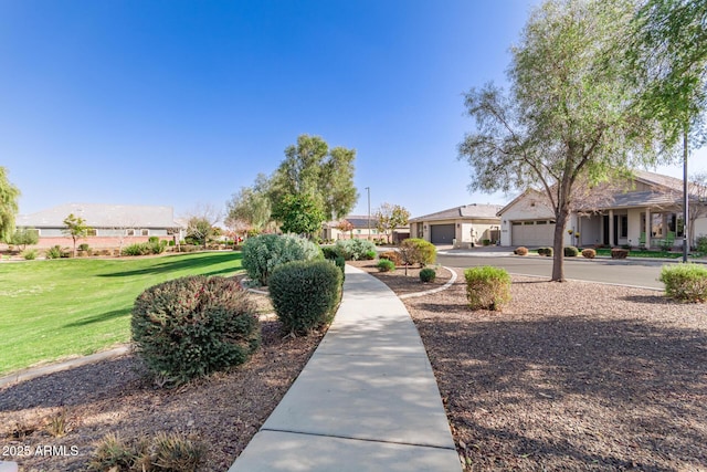 view of property's community with a lawn