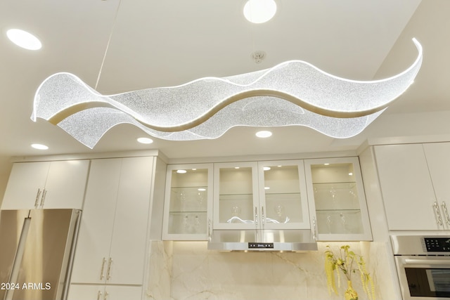 room details featuring white cabinetry and appliances with stainless steel finishes