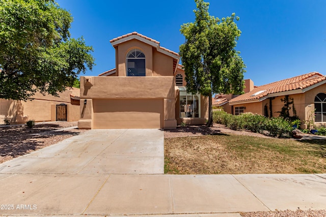 6439 E Redmont Dr, Mesa, AZ 85215 - view of front of house featuring stucco siding, driveway, a garage, and a tile roof
