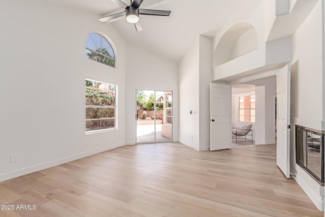 6439 E Redmont Dr, Mesa, AZ 85215 - unfurnished room with healthy amount of natural light, high vaulted ceiling, light wood finished floors, and a ceiling fan