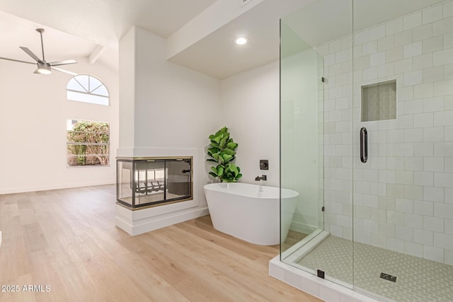 6439 E Redmont Dr, Mesa, AZ 85215 - full bathroom with wood finished floors, a stall shower, a ceiling fan, a soaking tub, and recessed lighting