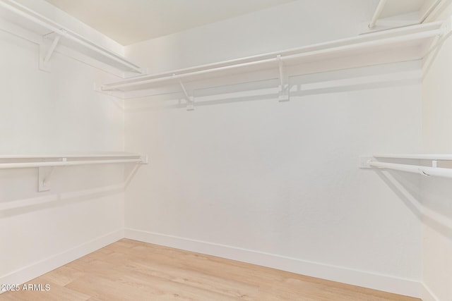 6439 E Redmont Dr, Mesa, AZ 85215 - walk in closet with wood finished floors