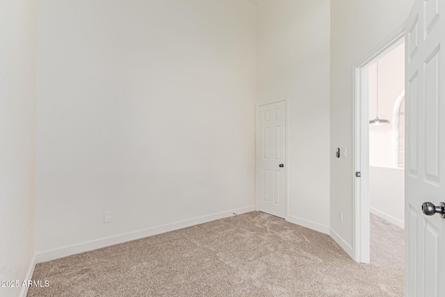 6439 E Redmont Dr, Mesa, AZ 85215 - carpeted spare room featuring baseboards and a towering ceiling