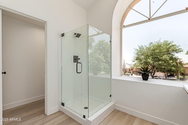 6439 E Redmont Dr, Mesa, AZ 85215 - bathroom featuring a stall shower and wood finished floors