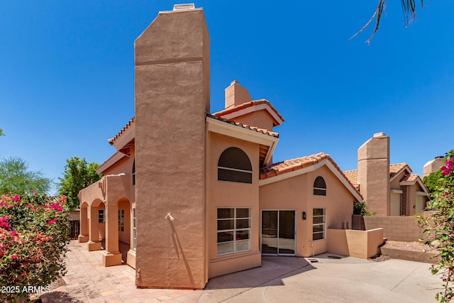 6439 E Redmont Dr, Mesa, AZ 85215 - back of property featuring a patio, stucco siding, and a tiled roof