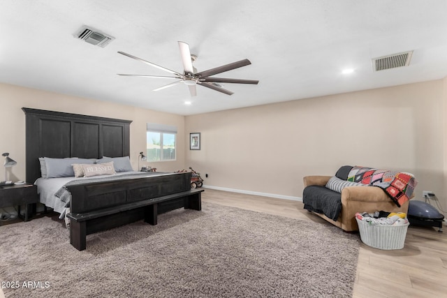 bedroom featuring ceiling fan and light hardwood / wood-style flooring