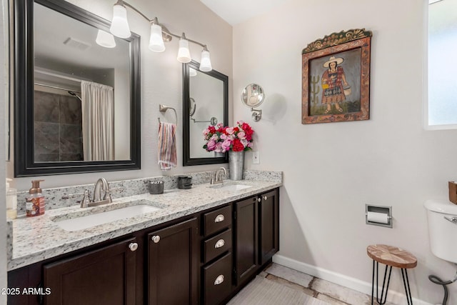 bathroom with tile patterned flooring, vanity, toilet, and a shower with shower curtain