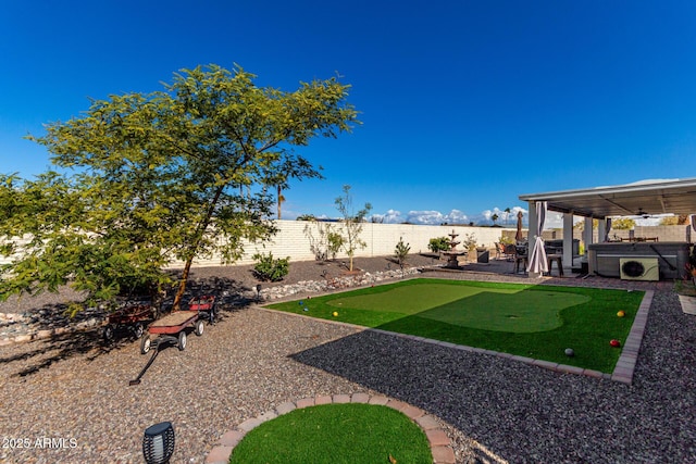 view of yard featuring a patio area and a hot tub