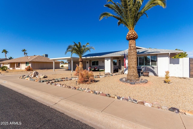 ranch-style house with a carport