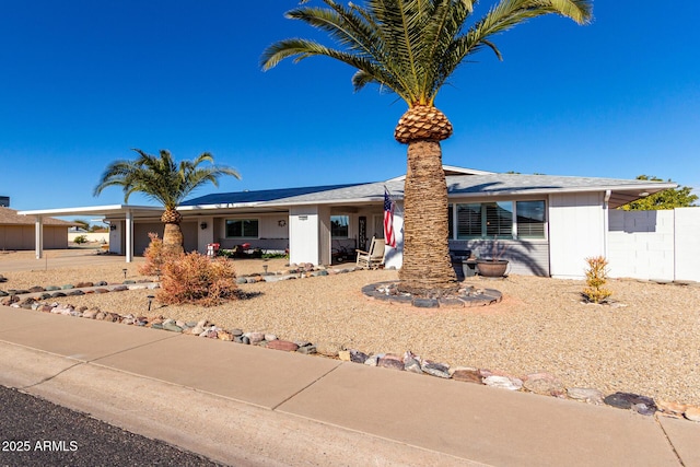 ranch-style house with a carport