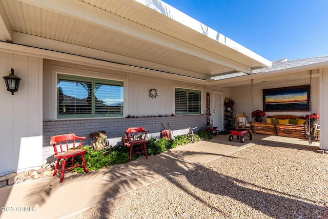 property entrance featuring a patio area