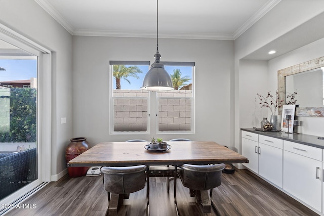1555 E Ocotillo Rd Unit 16, Phoenix, AZ 85014 - dining room featuring dark wood-type flooring and crown molding
