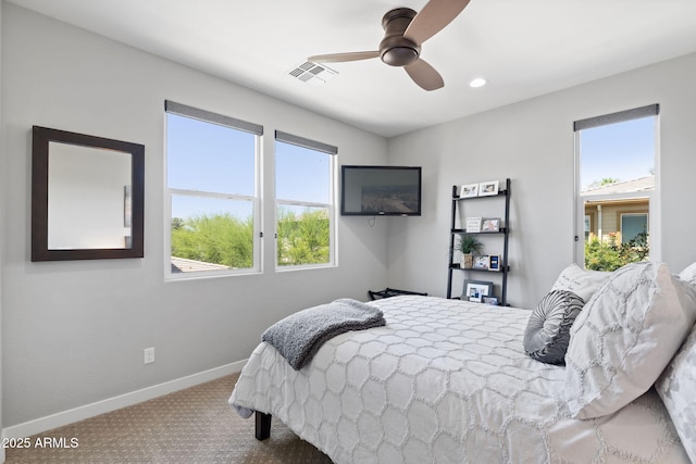 1555 E Ocotillo Rd Unit 16, Phoenix, AZ 85014 - bedroom with carpet flooring, multiple windows, baseboards, and a ceiling fan