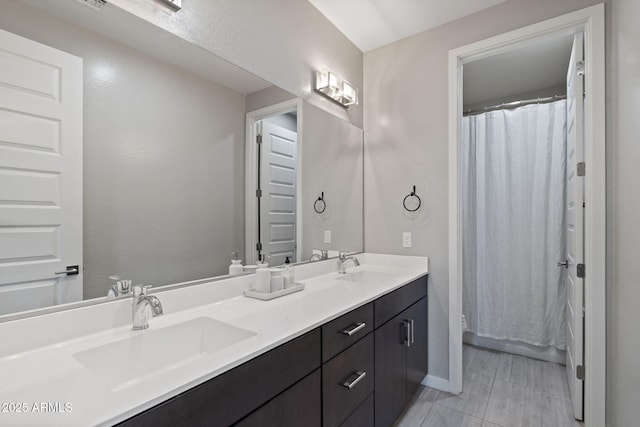 1555 E Ocotillo Rd Unit 16, Phoenix, AZ 85014 - bathroom with double vanity, toilet, and baseboards