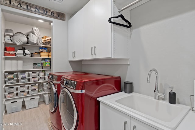 1555 E Ocotillo Rd Unit 16, Phoenix, AZ 85014 - washroom featuring cabinet space, washer and dryer, and wood finished floors