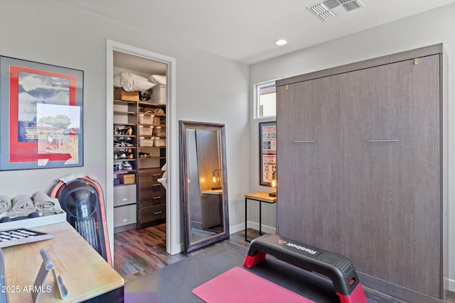 1555 E Ocotillo Rd Unit 16, Phoenix, AZ 85014 - exercise room featuring wood finished floors, recessed lighting, and baseboards