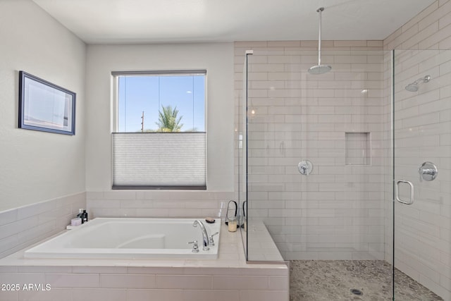 1555 E Ocotillo Rd Unit 16, Phoenix, AZ 85014 - full bathroom featuring a stall shower and a garden tub