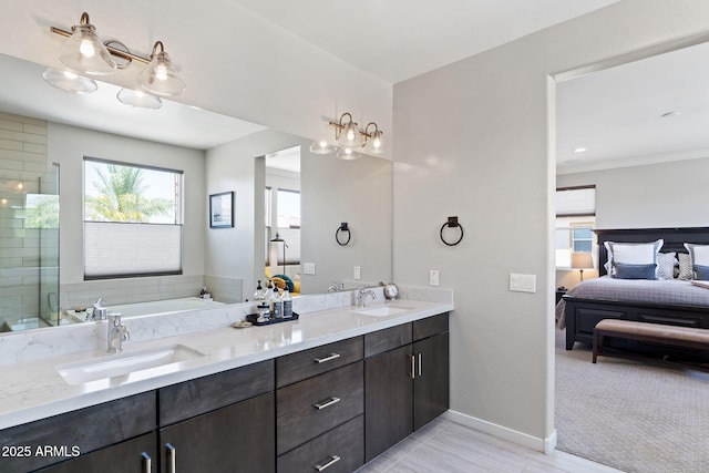 1555 E Ocotillo Rd Unit 16, Phoenix, AZ 85014 - full bath featuring ensuite bathroom, double vanity, a garden tub, baseboards, and tiled shower