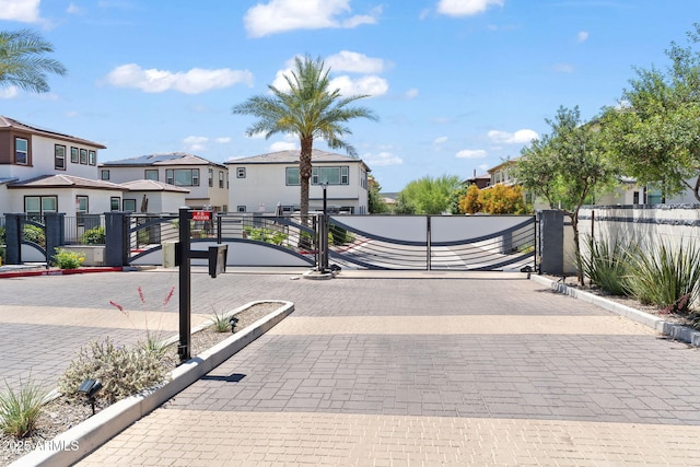 1555 E Ocotillo Rd Unit 16, Phoenix, AZ 85014 - view of decorative road with a residential view, a gate, curbs, and a gated entry