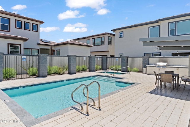 1555 E Ocotillo Rd Unit 16, Phoenix, AZ 85014 - community pool featuring a patio and outdoor dining space