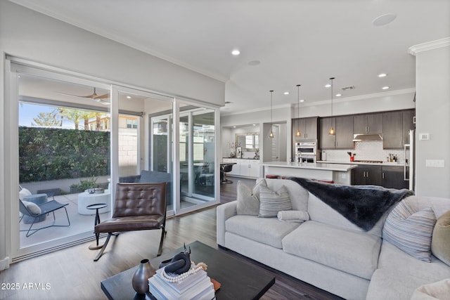 1555 E Ocotillo Rd Unit 16, Phoenix, AZ 85014 - living area featuring wood finished floors, ornamental molding, ceiling fan, and recessed lighting