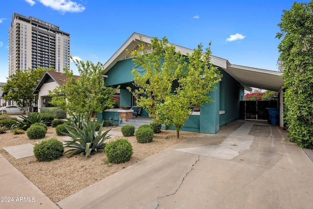 obstructed view of property with a carport