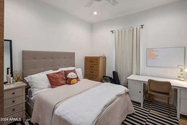 bedroom featuring built in desk and light wood-type flooring