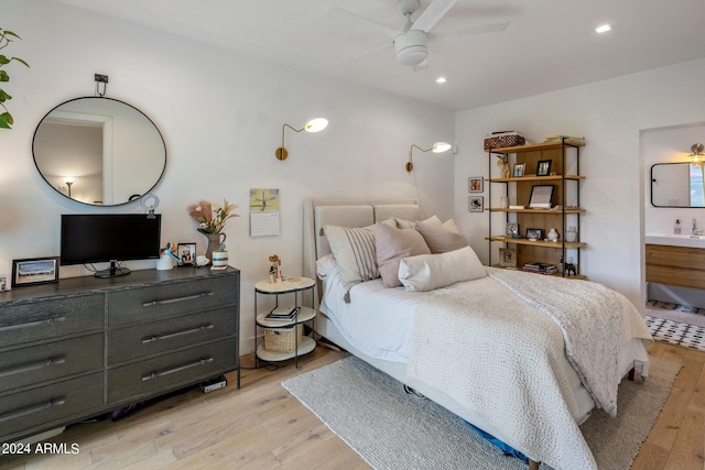 bedroom featuring sink and light wood-type flooring