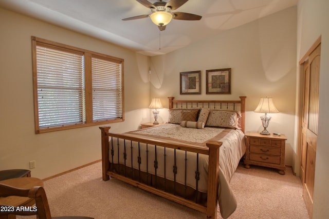 bedroom featuring light carpet and ceiling fan