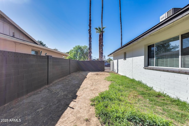 view of yard with a fenced backyard