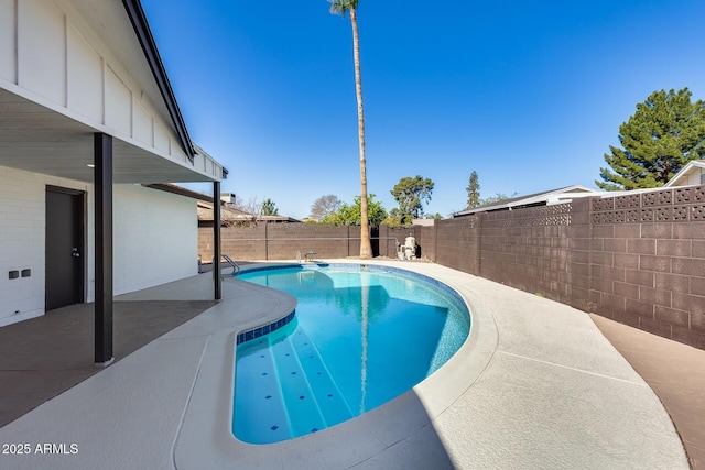 view of swimming pool with a fenced in pool, a fenced backyard, and a patio